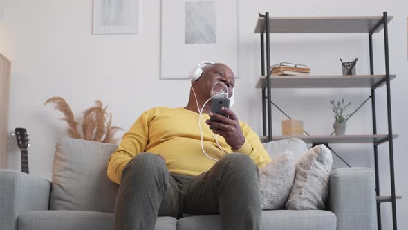 Enjoying Music Happy Senior Man Home Leisure alt