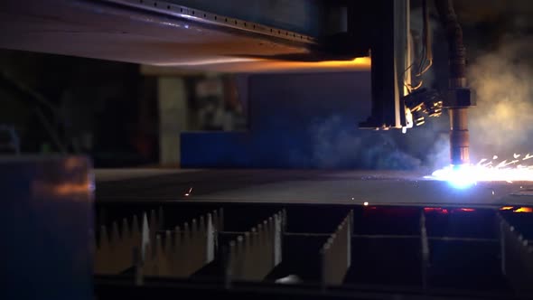 A close-up of the process of cutting metal sheet with a laser machine.