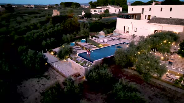 Couple on Vacation at Luxury Resort in Sicily During Sunset By the Infinity Pool in Sicilia Italy alt