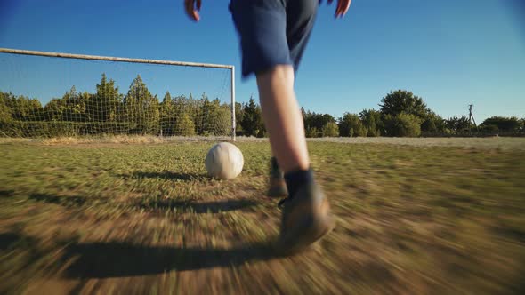 The Football Player Scores The Ball Into The Goal The Boy Kicks The Ball By Finevideo