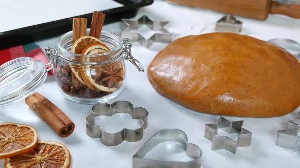 Gingerbread cookies dough, metal cutter, Christmas spices and decoration, dolly shot