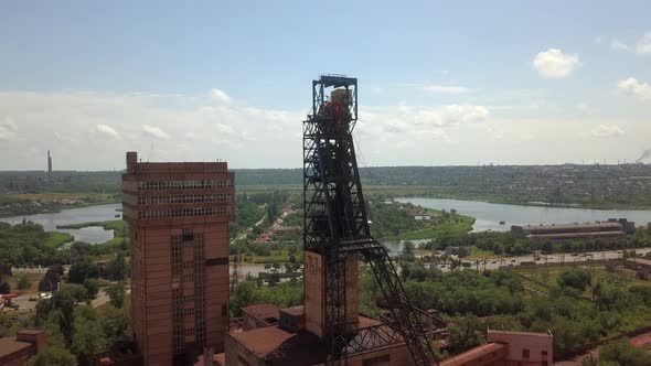 Mine in the city red iron ore aerial drone right side camera movement.Drone aerial high angle view alt