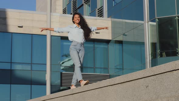 Stylish Cheerful Carefree Girl Walks Along Street Terrace Holding Hands Like Wings Pretending alt
