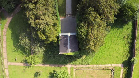 Aerial View From the Drone on the on the Narrow Passageway Leading to a Small Chapel