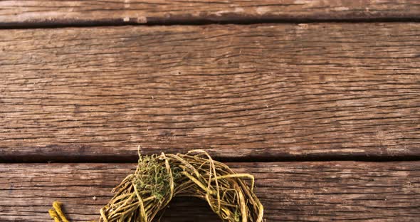 Grapevine wreath on wooden table 4k alt