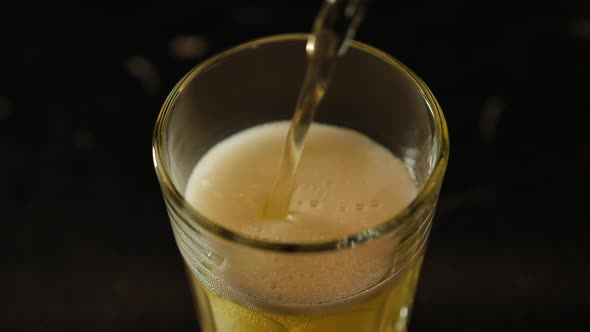 Beer is Poured Into a Glass