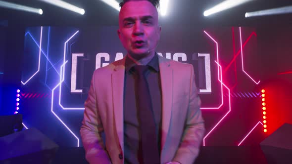 Energetic Man Announcing Gaming Tournament alt