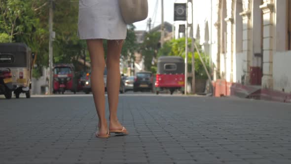 Woman Legs Walk Along Road Approaching Local Transport alt
