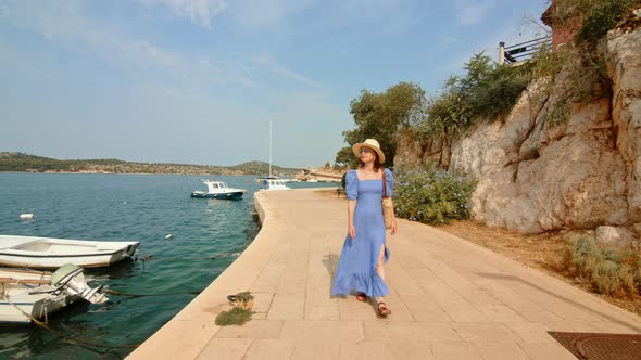 Young traveler on the pier in Sibenik, Croatia alt