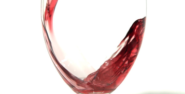 Red Wine Being Poured Into Glass