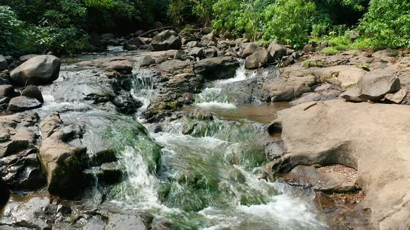 Beautiful Jungle stream cascading over the rocks in the wild jungles of the Western Ghats of India alt
