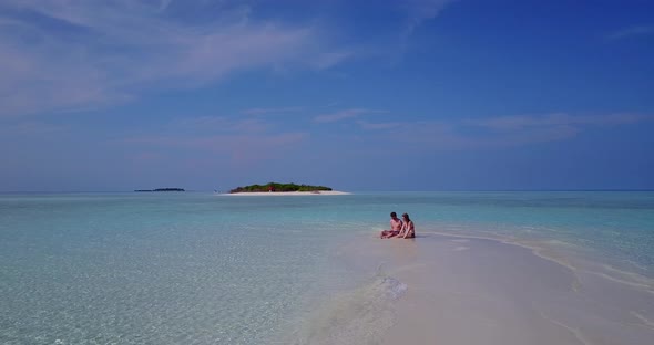 Beautiful boy and girl in love dating on vacation spend quality time on beach on clean white sand  alt