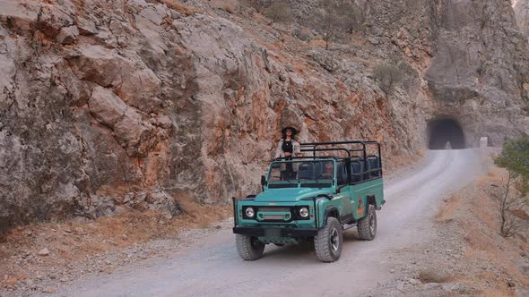 Traveler Woman Doing Offroad Tour On Rocky Road alt