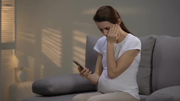 Crying Pregnant Lady Talking on Phone, Receiving Bad News, Depression and Sorrow alt