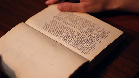 Girl Opens An Old Dictionary, Stock Footage | VideoHive