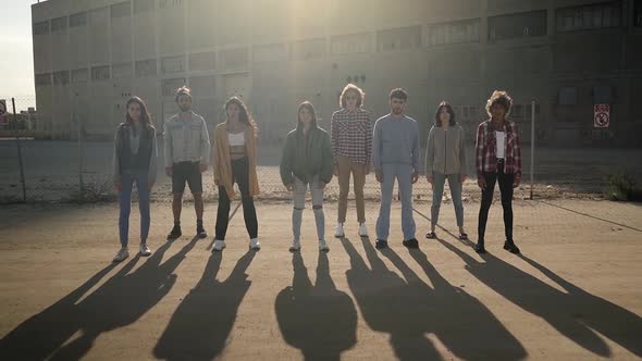 Group of Activist People Stand Facing the Camera During a Protest March alt