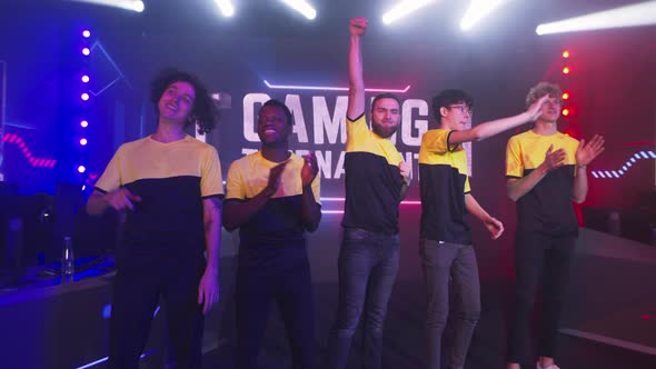 Diverse Cyber Sportsmen Greeting Audience alt