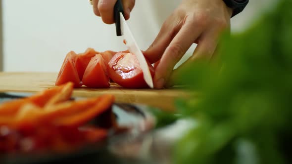 Cutting Fresh Tomato Using Kitchen Knife