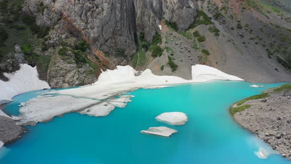 Atmospheric Alpine Landscape To Beautiful Glacial Lake in Highland Valley. Aerial View  alt