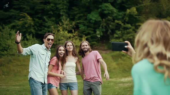 Happy Friends Taking Photos On Phone In Nature.