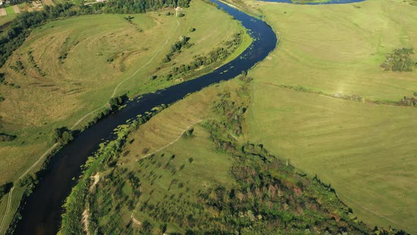 Aerial View Of Summer Trimmed Grass Meadow And River Coasts Landscape In Summer Day alt