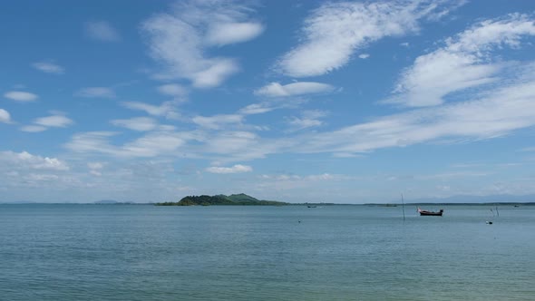 A long tail boat sailing in the sea