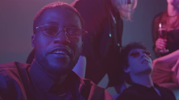 African-American Man at Night Club with Friends alt