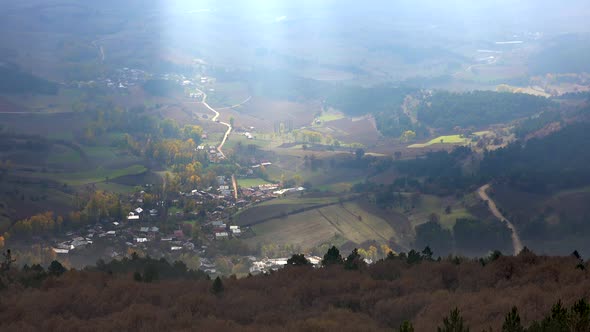 Sunbeam on the Cute Little Village in Autumn Plain alt
