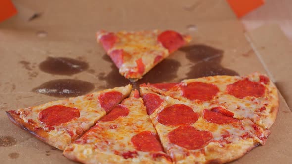 Human Hands Taking Pieces Slices of Hot Tasty Italian Pizza From Open Box, Food Delivery Service at alt