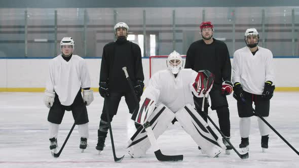 Portrait Of Hockey Players On Ice Rink alt