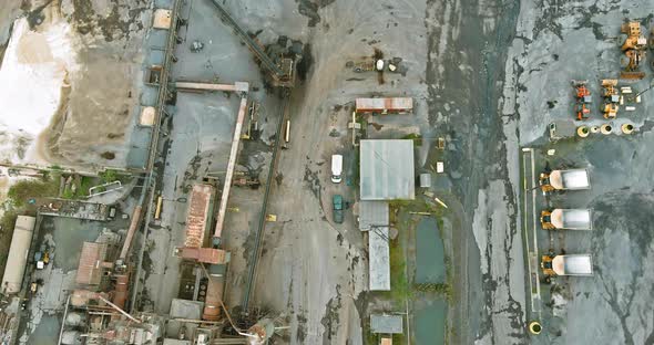 Aerial panorama view dumpers and machines are working in the quarry mine for special equipment alt