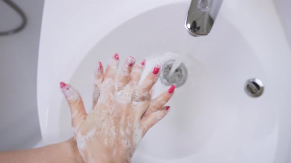 Washing hands in slow motion. Hygiene and coronavirus prevention, disinfection. Handbody antiseptic