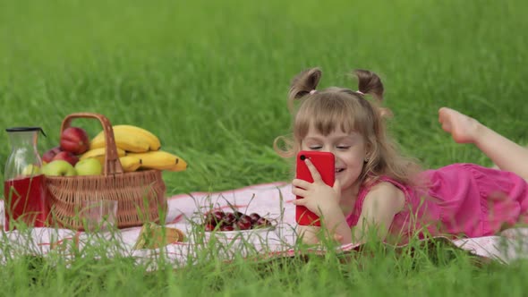 Weekend at Picnic. Girl on Grass Meadow Play Online Games on Mobile Phone. Social Network, Chatting alt