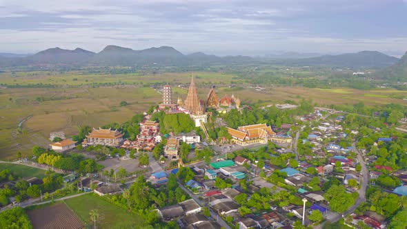 Aerial view of Big Golden Buddha Statue and pagoda in Tiger Cave Temple or Wat Tham Suea alt