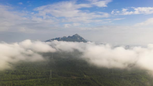 Morning time during sunrise with fog above the mountain, alt