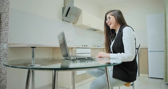 Student with Long Hair in Classic Vest with Sportive Pants alt