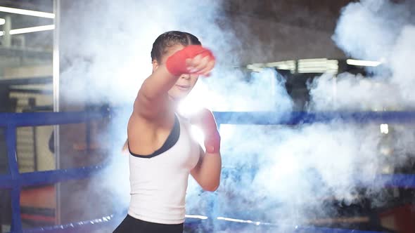 Fit Slim Caucasian Woman Training, Boxing in Ring