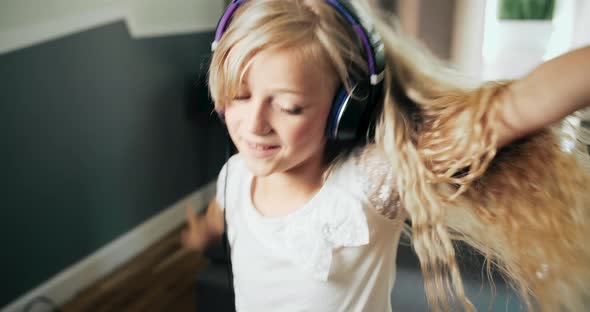 Teen Girl in Headphones Dancing