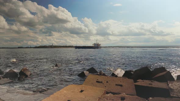 A Cargo Ship Enters the Harbor on the Daugava River