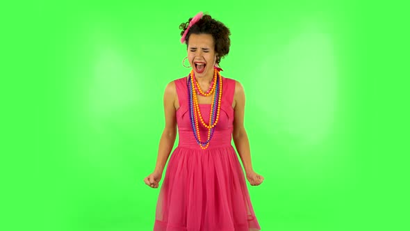 Upset Girl Screaming Hard Covering Her Ears with Her Hands. Green Screen at Studio alt