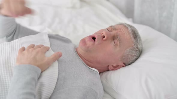 Sick Senior Old Man Sleeping in Bed and Coughing alt