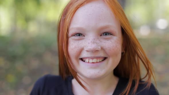 Natural Appearance of a Girl with Beautiful Freckles on Her Face alt