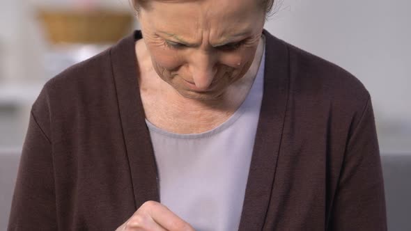 Desperate Woman Counting Coins and Crying, Helplessness and Poverty, Insecurity alt