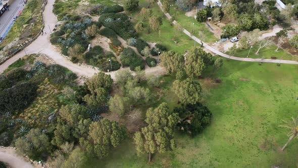 Aerial view flying in over Spiegel Park in Tel Aviv, Israel. A large recreational area in the city w alt
