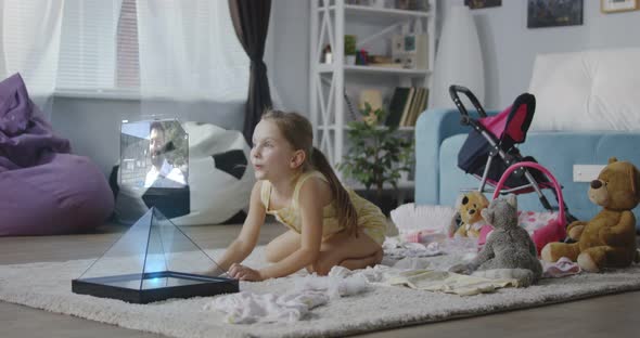 Girl Having a Video Call with Her Father alt