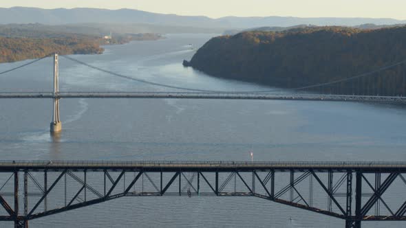 Aerial of walkway and Mid-Hudson Bridge over Hudson river alt