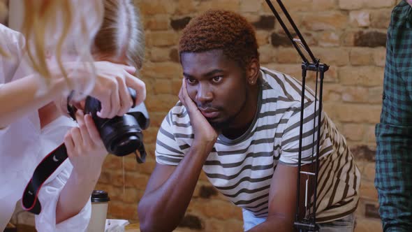 Young Designers Working with Color Palette and Sketches in Studio