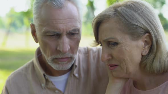 Old Couple Crying and Hugging, Supporting Each Other in Disease, Poverty alt