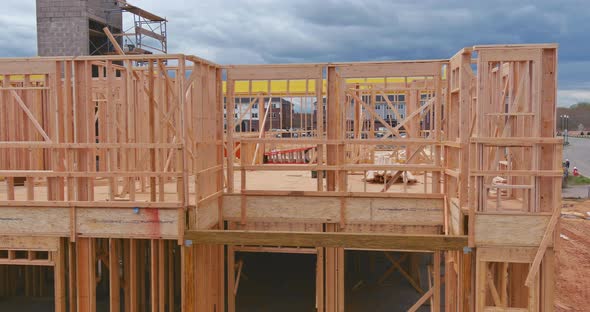 Framing of Under Construction Wooden House Building Frame Structure on New Development alt