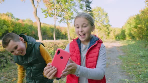 Children Filming Themselves on the Phone alt